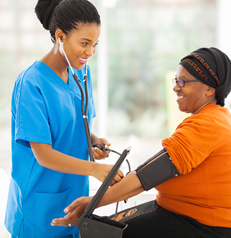 Nurse measuring an older woman's blood pressure