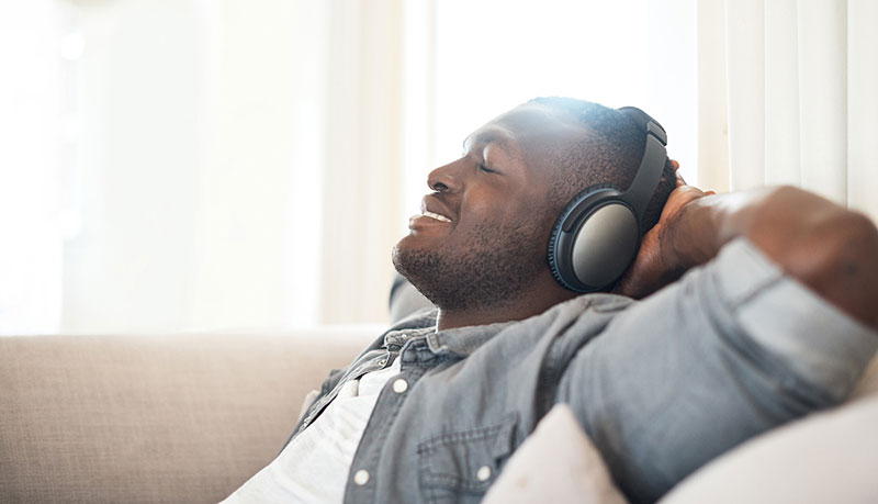 stress-free smiling man wearing headphones