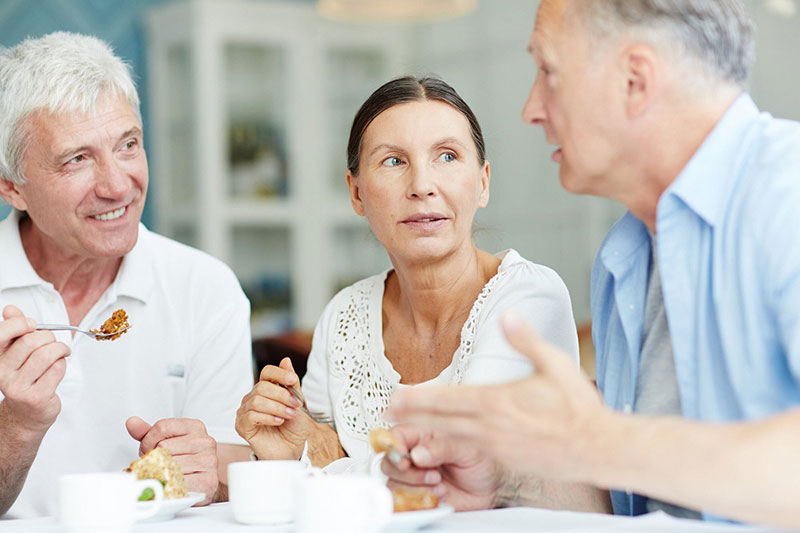 seniors talking over breakfast