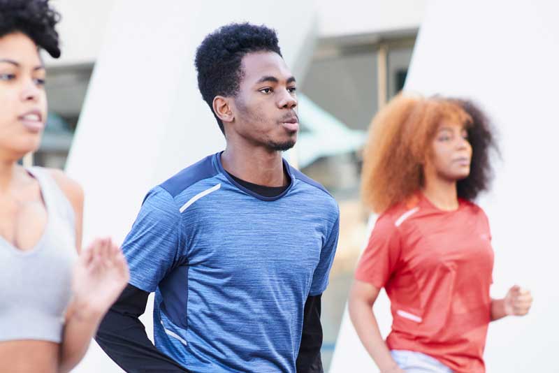 Young adults jogging in place