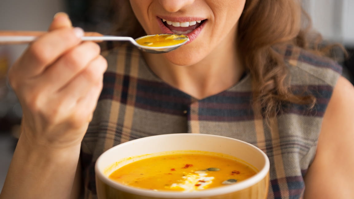 woman eating soup