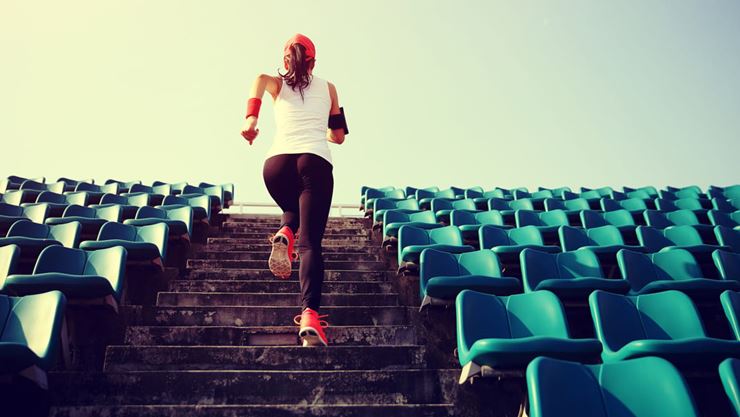 woman running up stairs outdoors